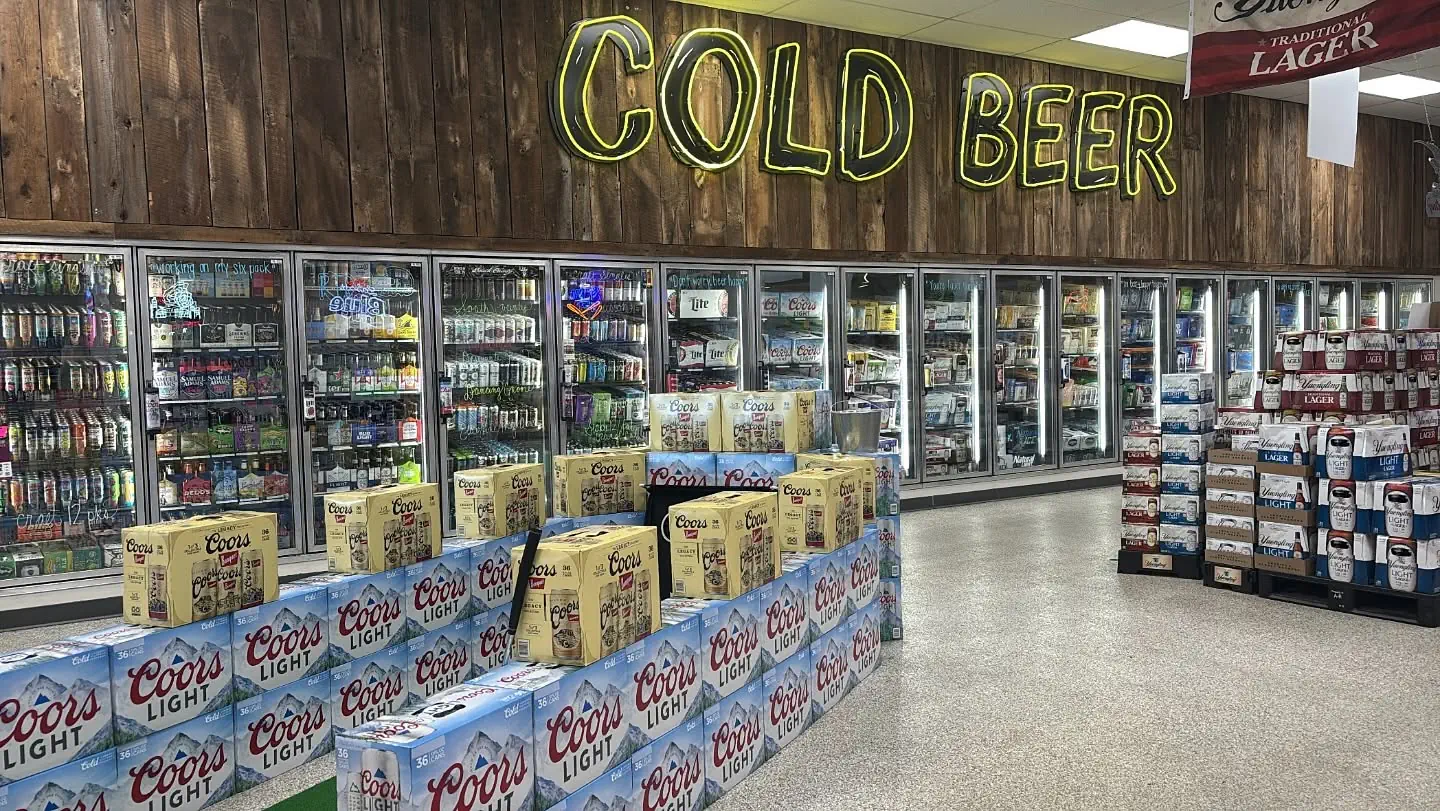 Cold beer coolers with neon sign